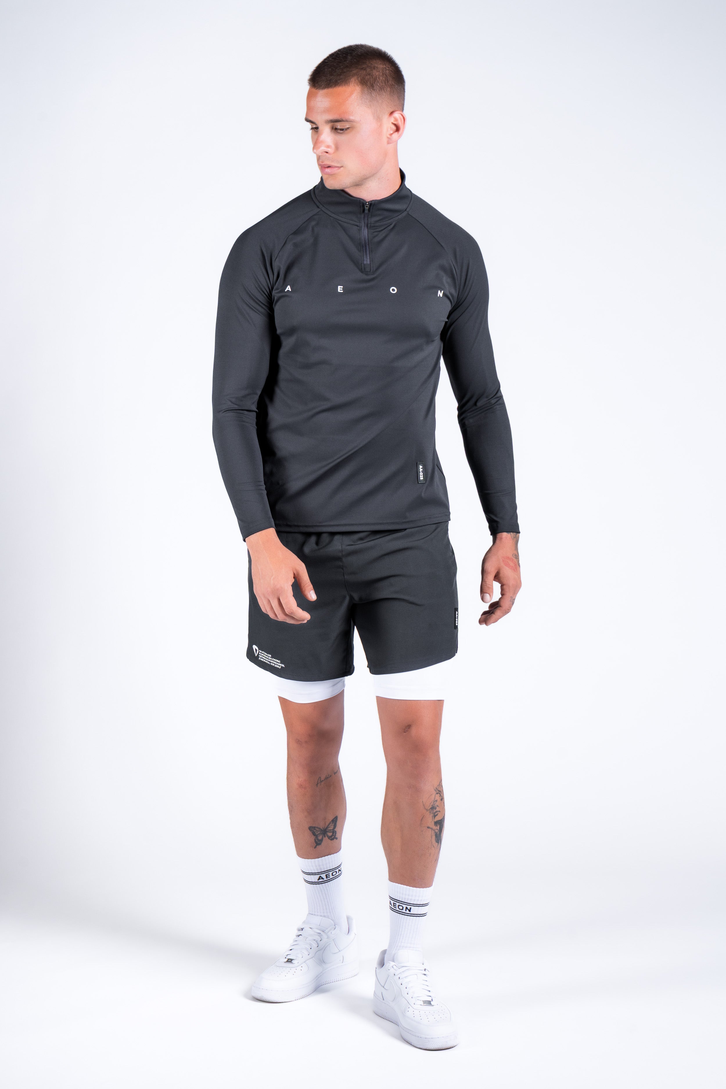 ICON PERFORMANCE HALF ZIP TEE